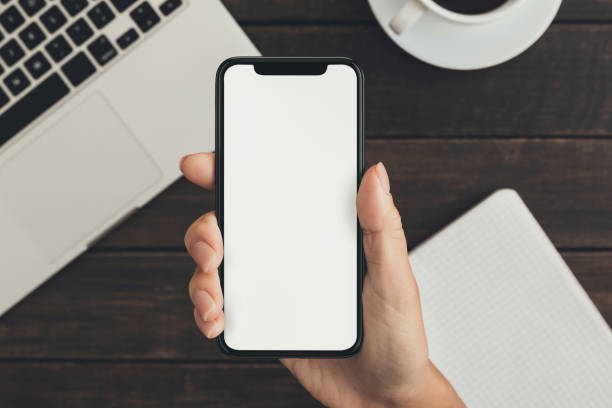 istock Hand holding smartphone with big blank screen 1087264558