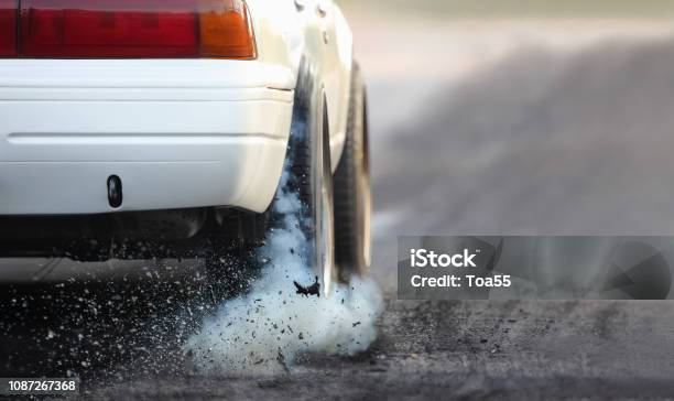 Drag Racing Car Burns Rubber Off Its Tires In Preparation For The Race Stock Photo - Download Image Now
