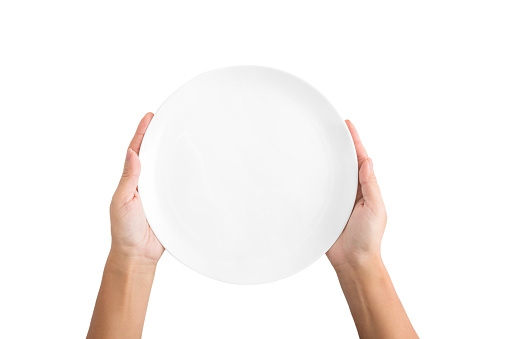 Hunger concept. Woman holding empty plate waiting for food, isolated on white background, top view, copy space