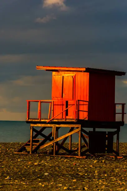 Photo of The sunrises lighting the small wooden house on the beach in Bat