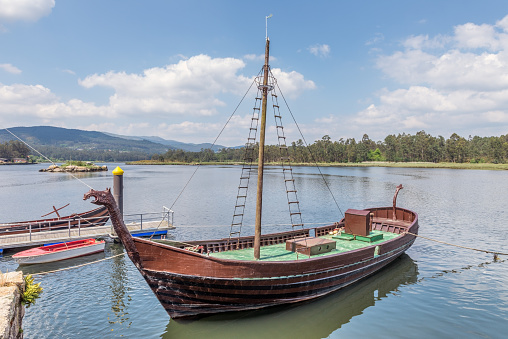 image of viking ship at the pier, replica