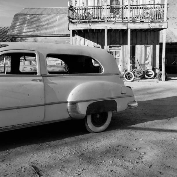 istock Abandoned car and old western style house 108727828