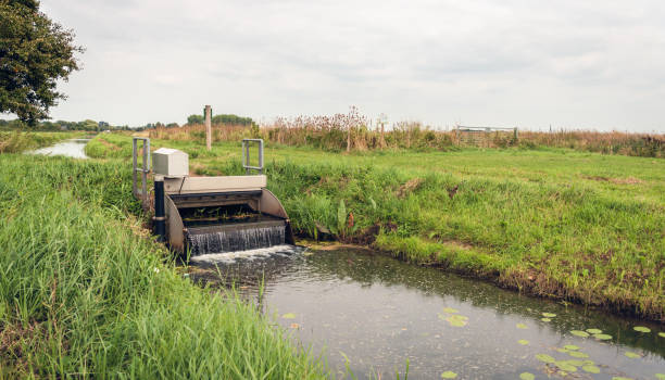 istock Automatic working small weir controls the water in a Dutch polder 1087279718