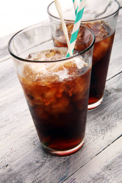 istock Ice coffee on a rustic table with cream being poured into it showing the texture and refreshing look of the drink 1087281186