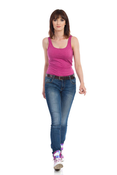 istock Serious Young Woman Is Walking Towards Camera 1087281676