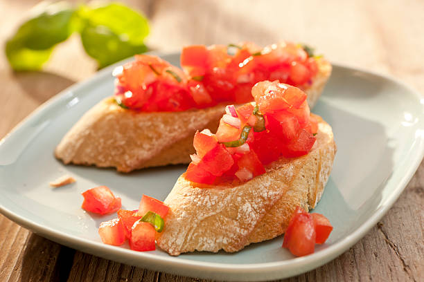 Bruschetta - baguette with diced tomatoes stock photo