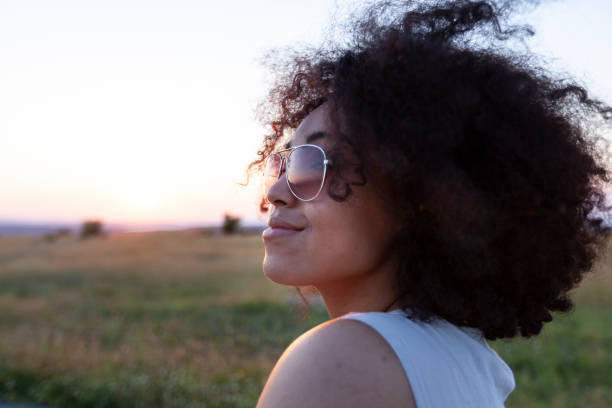 istock Young woman having fun at sunset 1087288120