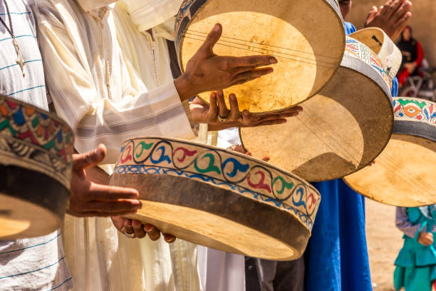 Berber Wedding In Merzouga Desert Erg Chebbi, Sahara Desert, Morroco - September 25, 2014: Unidentified Berber people in wedding ceremony with their traditional dress, women dance with their authentic music. berber stock pictures, royalty-free photos & images