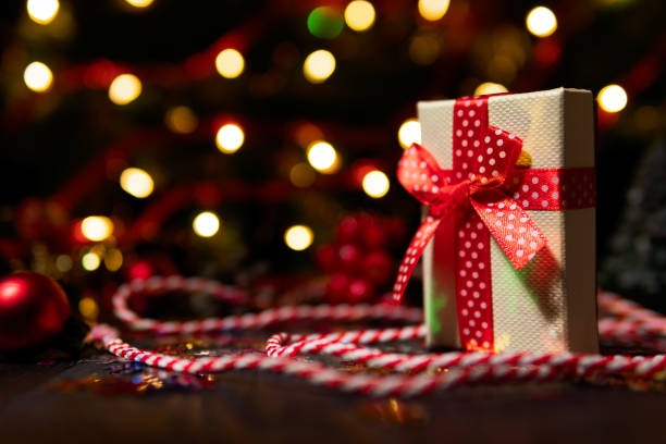istock Wrapped gift box in red ribbon 1087292170
