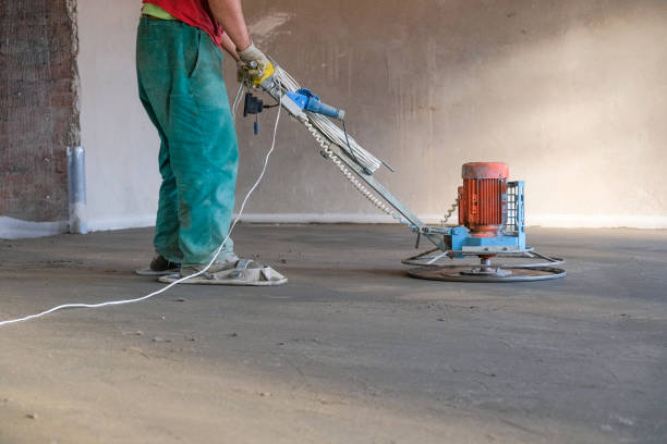 istock the workers grind the concrete floor at the construction site 1087292660