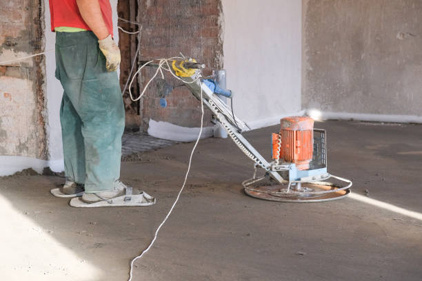 istock the workers grind the concrete floor at the construction site 1087292694