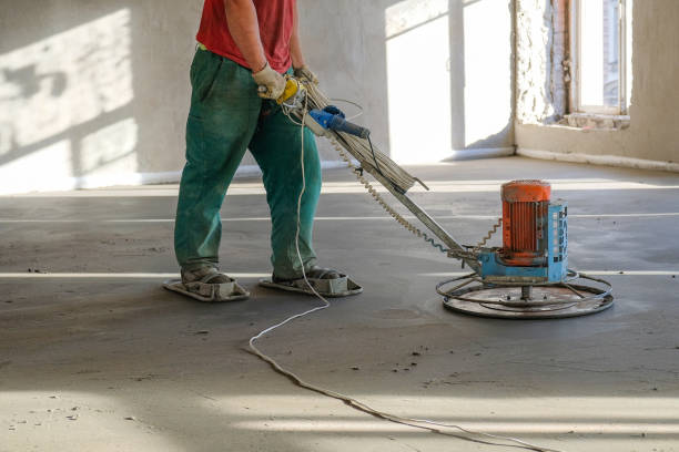 istock the workers grind the concrete floor at the construction site 1087292708