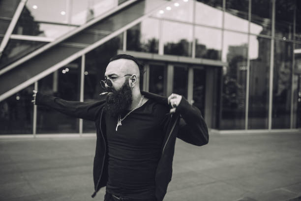 istock Bearded man putting on his sweatshirt 1087293914