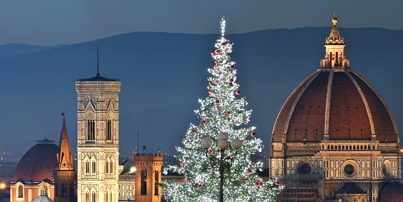 Illuminated Christmas Tree at Piazzale Michelangelo with the Cathedral of Santa Maria del Fiore on background. Italy