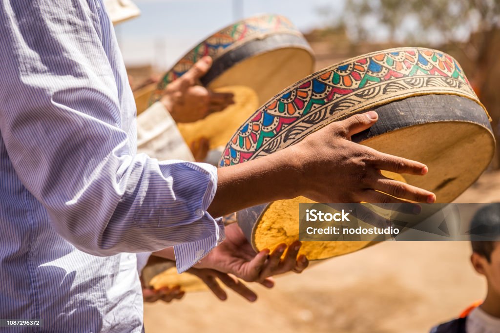 Berber Wedding In Merzouga Desert Unidentified Berber people in wedding ceremony with their traditional dress, women dance with their authentic music. Morocco Stock Photo