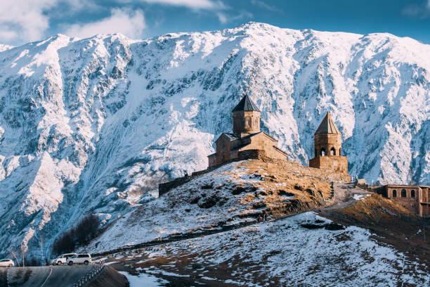 istock Stepantsminda, Georgia. Famous Gergeti Trinity Tsminda Sameba Church In Early Winter 1087301618