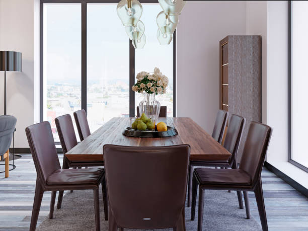 istock Panoramic windows in luxury dining room with wooden table and leather chairs next to showcase and designer hanging lamps. 1087301666