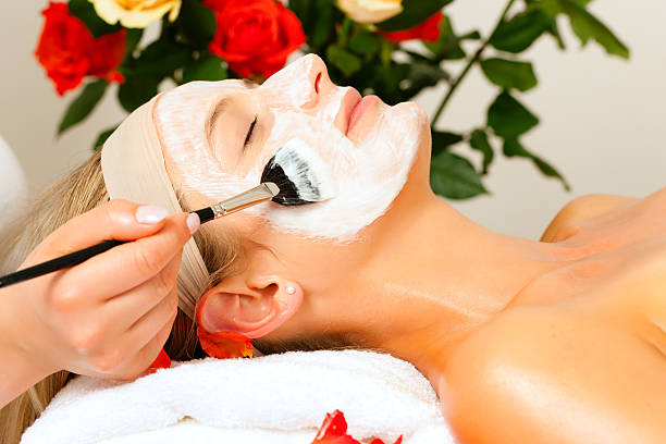 istock Cosmetics and Beauty - applying facial mask 108730195