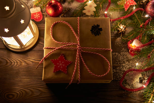 istock Wrapped gift box in light of garland 1087303048