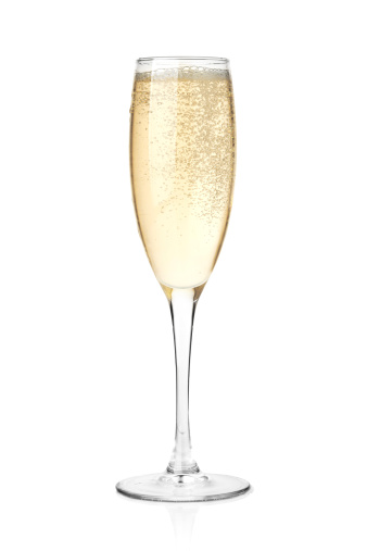 Champagne in a glass. Isolated on white background