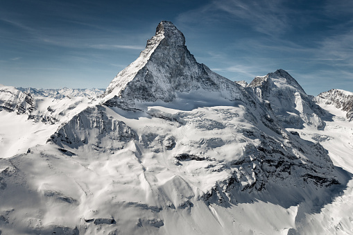 Aerial view of majestic and world famous Matterhorn mountain in front of a blue sky, Switzerland