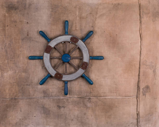 istock wooden ship's steering wheel 1087307656
