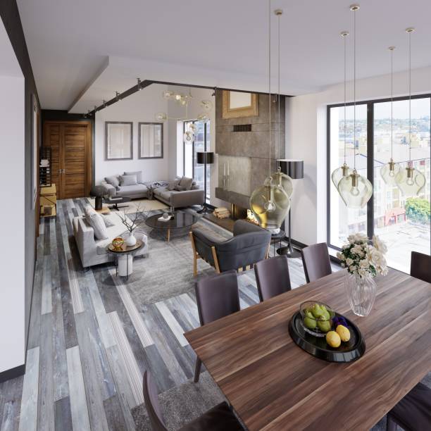 istock Design apartment with a dining table and a large loft-style living room with sofas and a large fireplace and panoramic windows. 1087311564