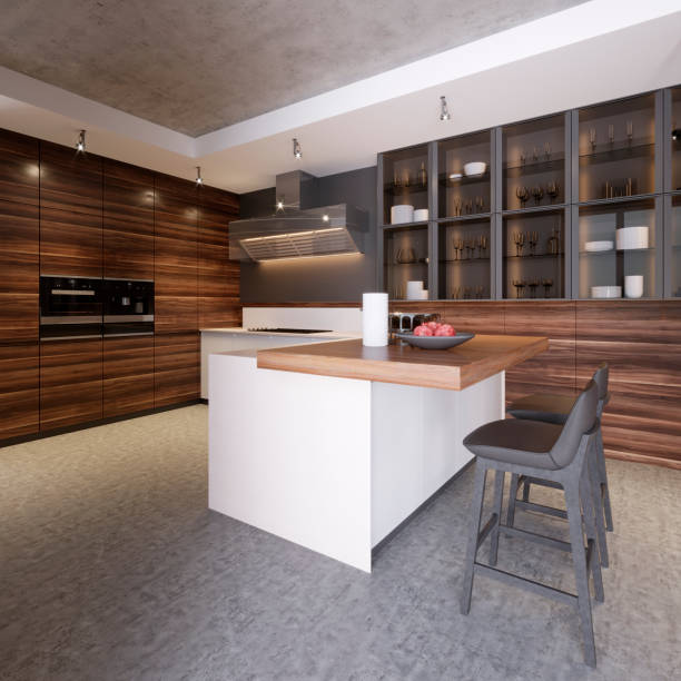 istock Kitchen interior with concrete walls, white countertops and consoles, large windows, a concrete floor and a bar stand with stools. 1087313180