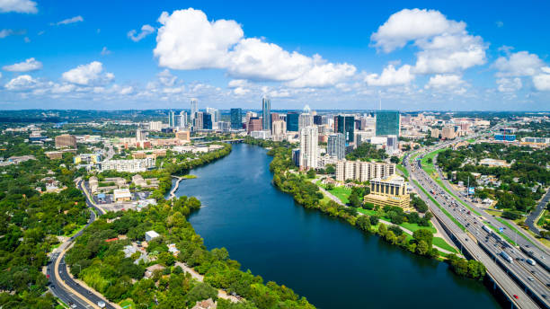 Austin Texas summertime Austin Texas Puffy Clouds on a Summer Day blue sky and gorgeous water over Town Lake Skyline Cityscape summertime colorado river photos stock pictures, royalty-free photos & images