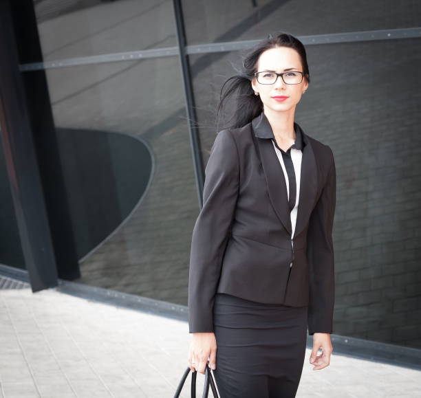 istock Business suit, glasses, city, half height 1087313500