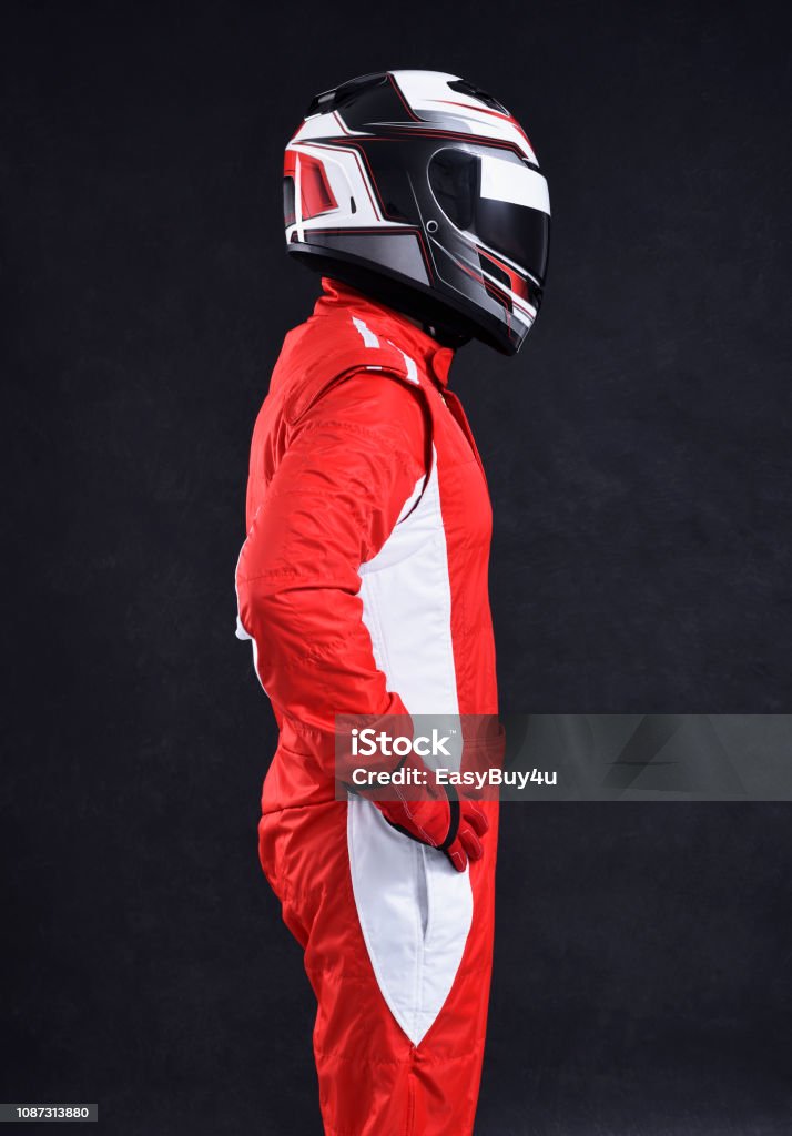 Race car driver Race car driver on a black background, side view Race Car Driver Stock Photo