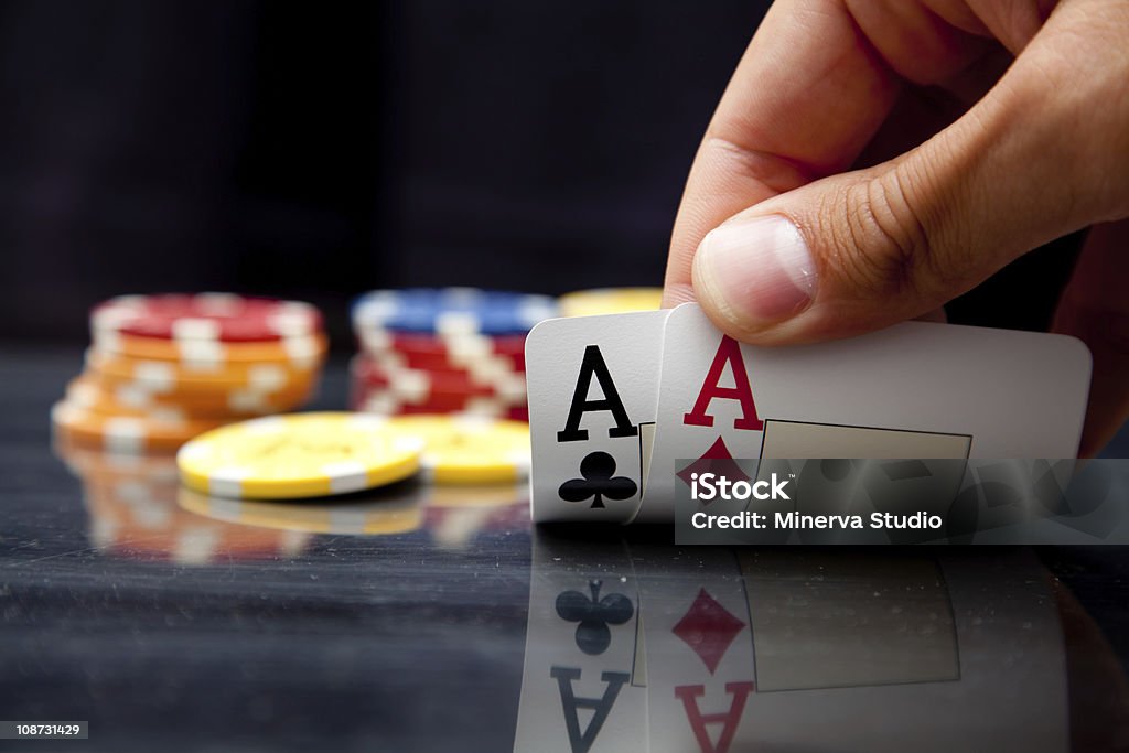 All in! Two aces while playing poker. It's worth betting everything you have. Gambling Chip Stock Photo