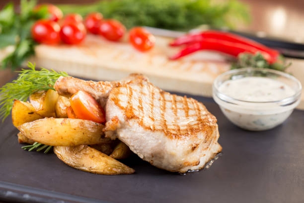 istock Grilled steaks with potatoes and vegetables 1087320596
