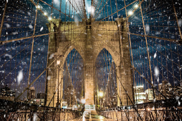 Brooklyn Bridge with snow falling stock photo
