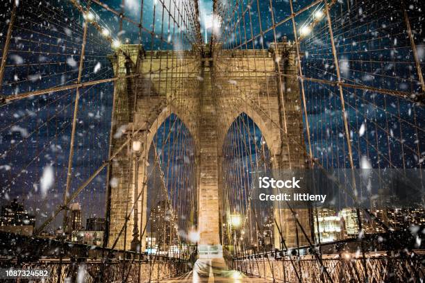 Brooklyn Bridge With Snow Falling Stock Photo - Download Image Now - New York City, Snow, Winter