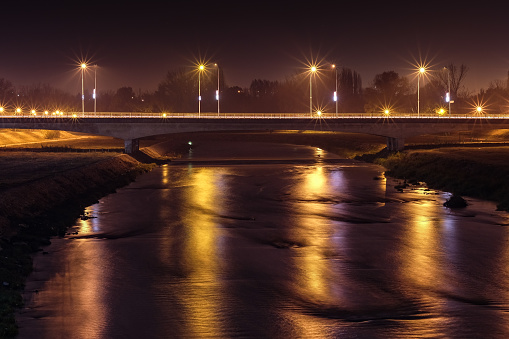 A long exposure night shot of a bridge over the river Vardar in Skopje, Macedonia.