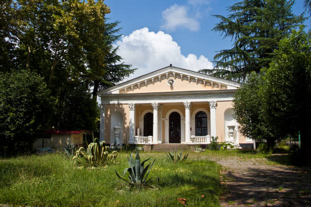 istock Old abandoned mansion in overgrown park 1087325900