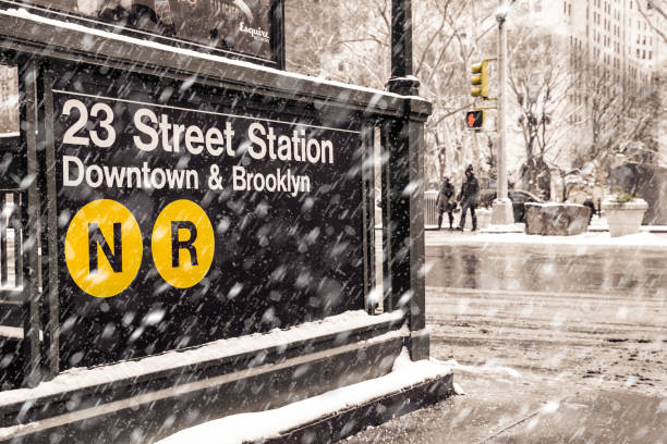 Snowy New York City street scene with subway station