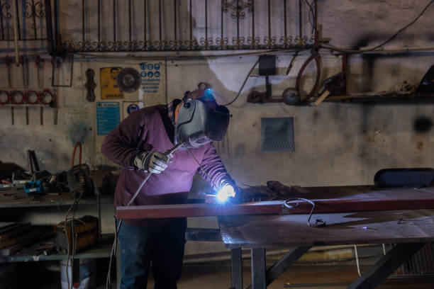 istock Arc welder with welding sparks 1087328188