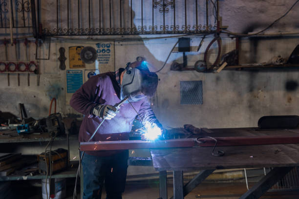 istock Arc welder with welding sparks 1087328428
