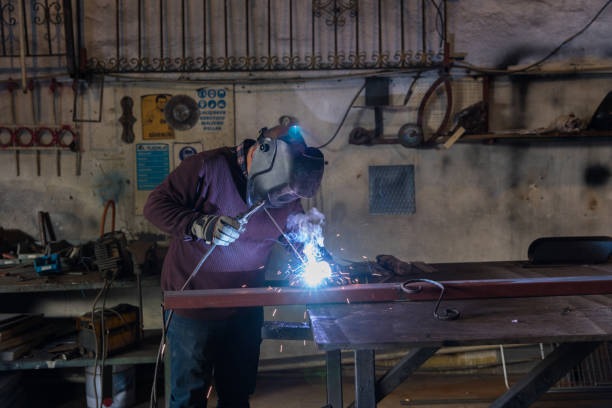 istock Arc welder with welding sparks 1087328776