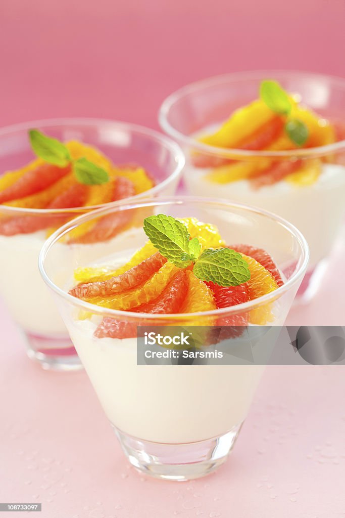 Panna cotta, S. Panna cotta with orange and grapefruit in glasses Backgrounds Stock Photo