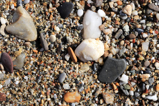 istock Different stones on the beach with little pebbles texture. 1087338410