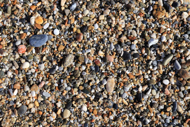 istock Different stone pebble on the beach. Nautical marine background. 1087338474