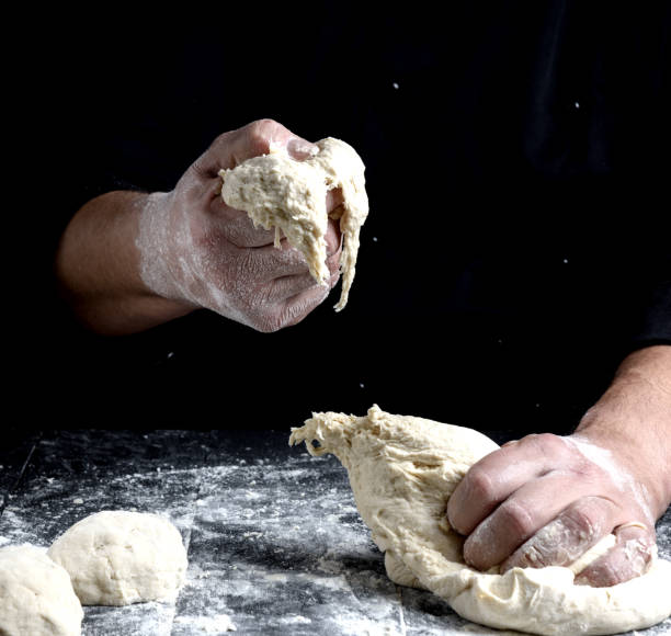 istock male hands substitute white wheat flour dough 1087338716