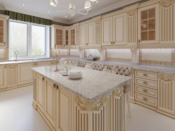 istock Kitchen island in a luxurious classic style kitchen. 1087343298