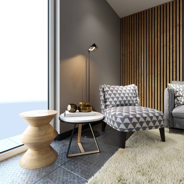 istock Designer soft armchair in loft style with two creative side tables with decor and floor lamp, patterned fabric. 1087344672
