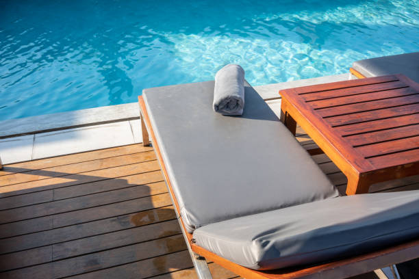 istock Grey Towel on relaxing pool bed beside swimming pool. 1087344946