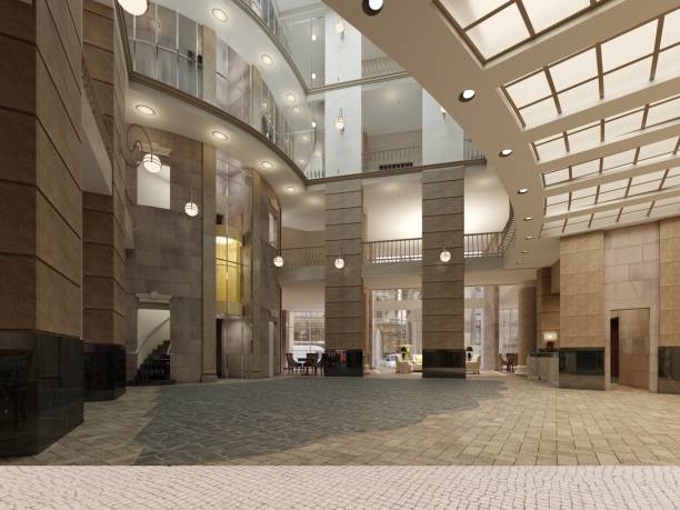 istock The interior design of the hotel lobby with a large multi-storey interior space. Stone columns, balconies and interfloor elevators. 1087346500