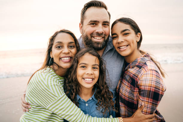 istock Smiling parents with two children 1087352166